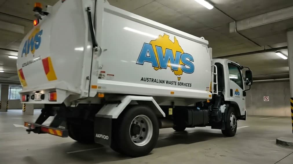 Low-clearance AWS truck in a basement loading area